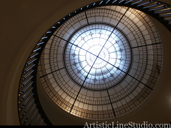 stained and leaded glass dome with jewels and beveled glass with round railings